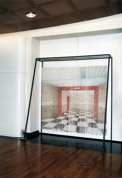 Installation with beads representing an interior space