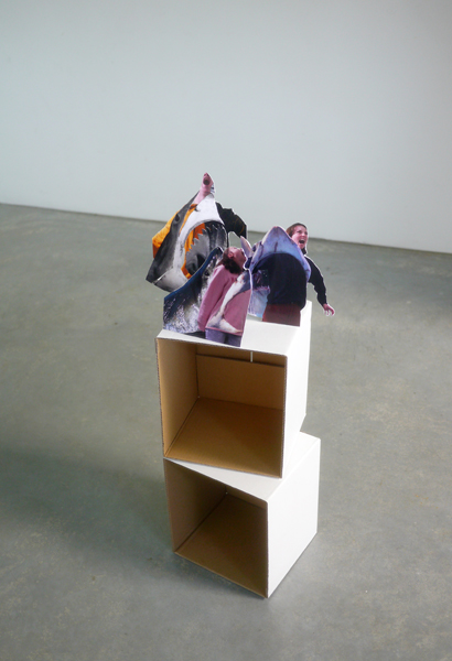 Two boxes with photograph cut-outs