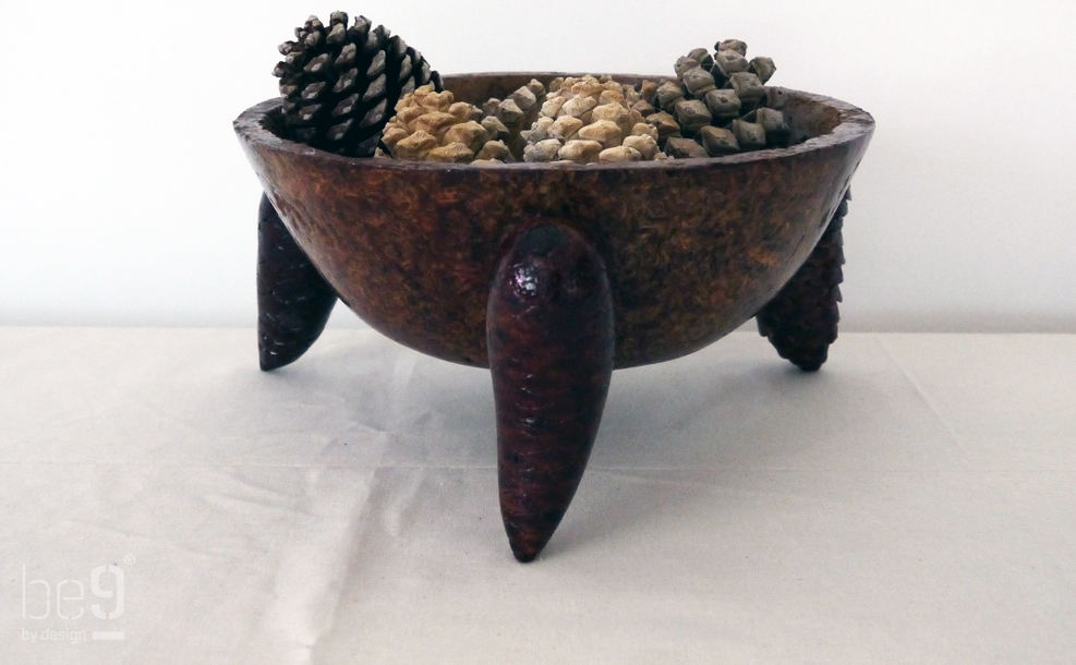 Dome shaped pine chip bowl with pine cones